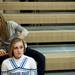 Skyline cheer leading coach Courtney Boes combs sophomore Meredith McDevitt's hair before the game against Father Gabriel Richard on Friday. Daniel Brenner I AnnArbor.com